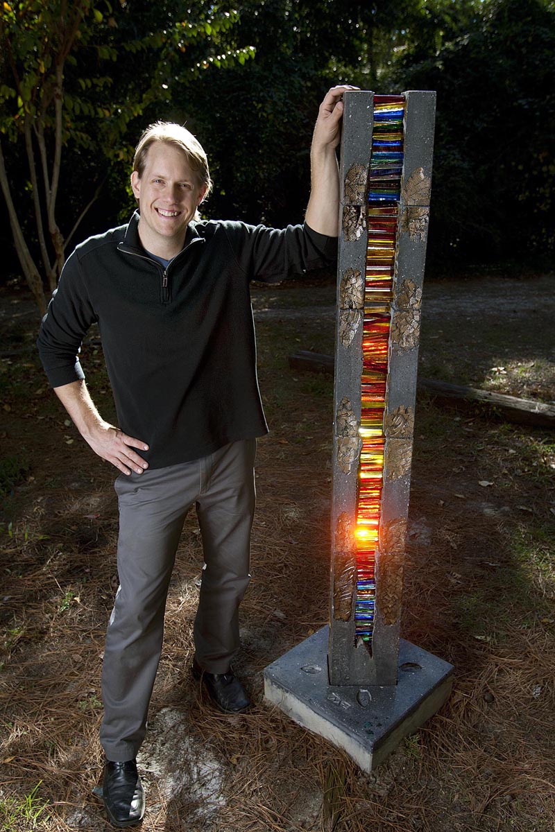 SCOTT THRELKELD / THE TIMES-PICAYUNECovington artist Michael Eddy, photographed Friday, October 29, 2010, with his glass and polished concrete sculpture, 'Totemic Rip Services.'